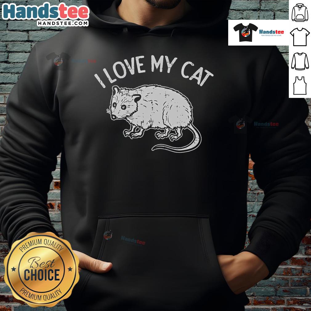 Adorable opossum wearing a 'I Love My Cat' hoodie, showcasing a humorous pet-themed fashion statement.