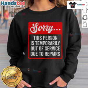 Funny sweatshirt saying 'Sorry, person is temporarily out of service due to repair' for a humorous touch.