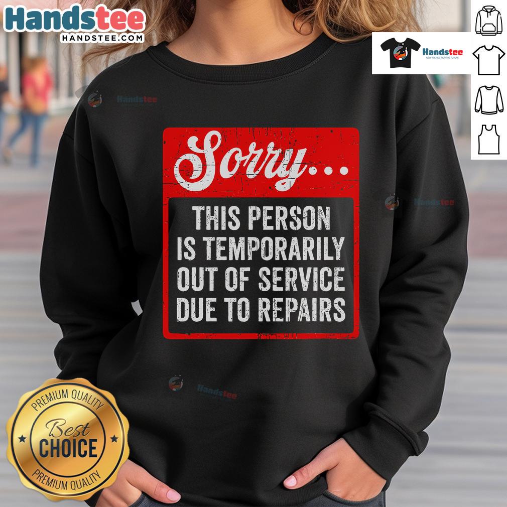 Funny sweatshirt saying 'Sorry, person is temporarily out of service due to repair' for a humorous touch.