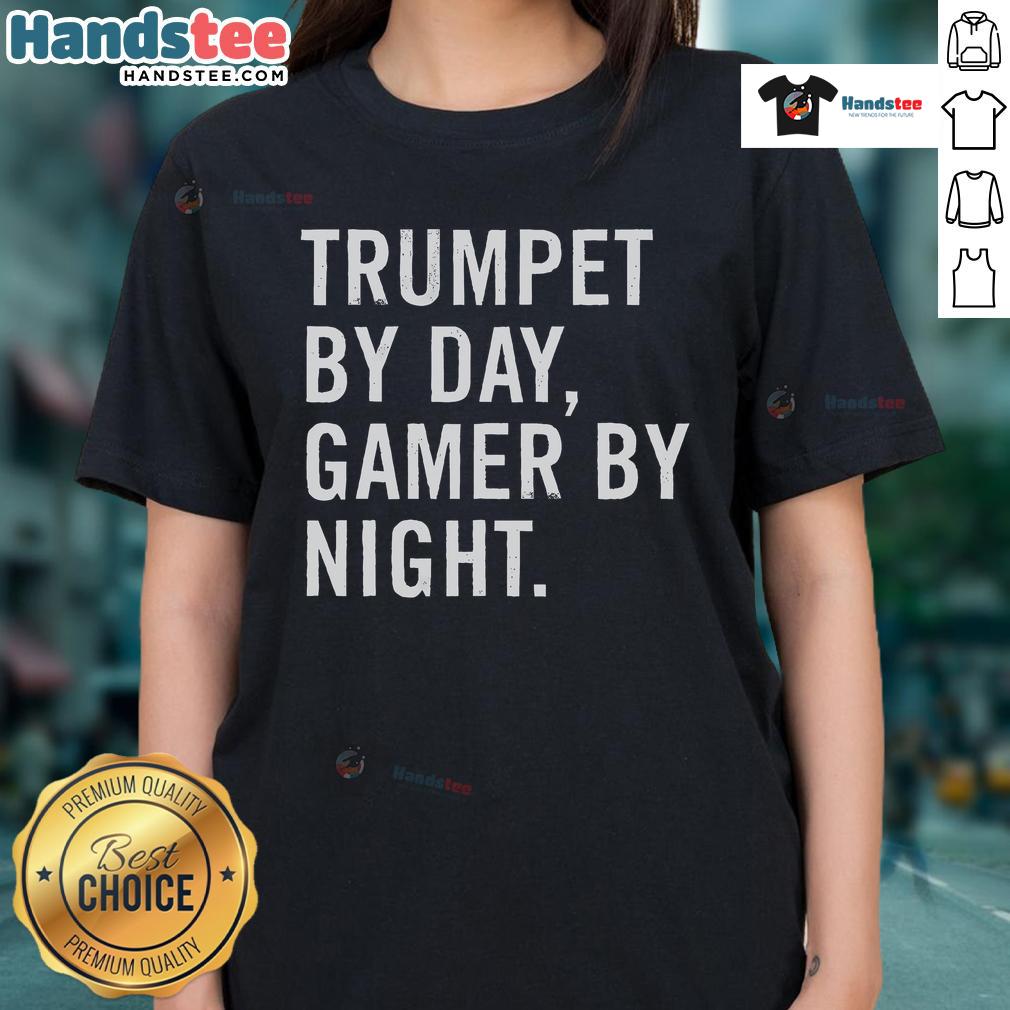 Funny trumpet musician wearing a tee that says 'Trumpet by day, gamer by night' showcasing a playful musical theme.