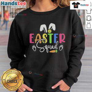 Family wearing matching sweatshirts for Easter Day bunny egg hunt, showcasing fun and festive spirit in vibrant colors.