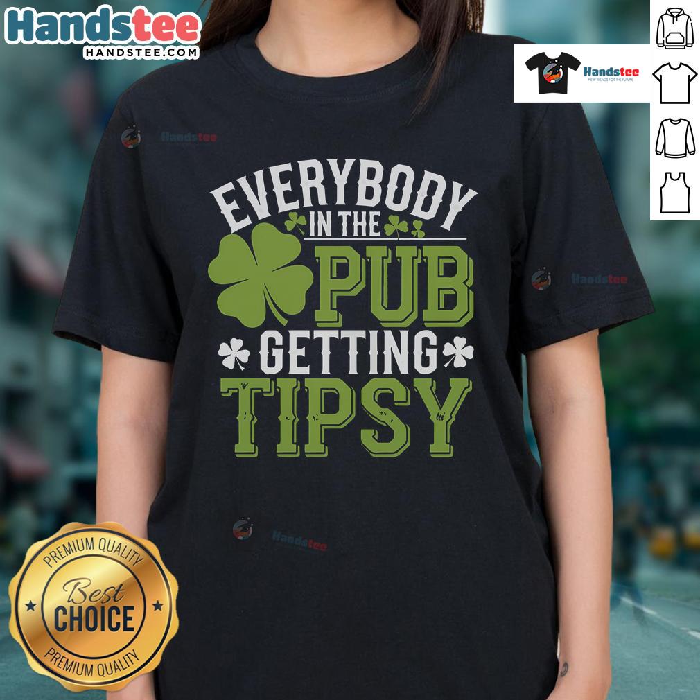 Group of friends enjoying St. Patrick's Day at the pub, wearing ladies tees and sharing laughs while getting tipsy.