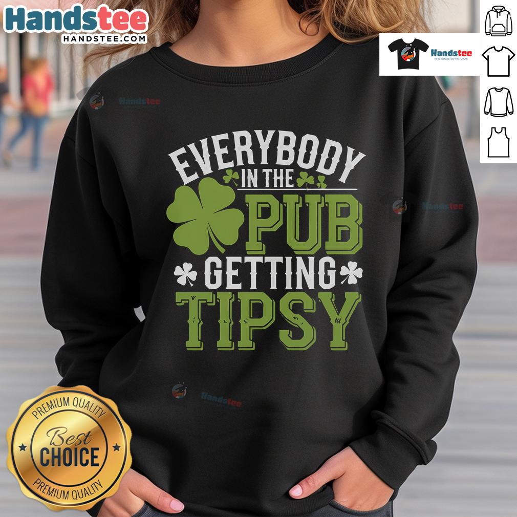 Group of friends in a pub wearing St. Patrick's Day sweatshirts, enjoying drinks and celebrating together.
