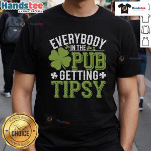 Group of friends wearing 'Good Everybody In The Pub Getting Tipsy' St Patrick's Day T-shirt, celebrating with drinks.