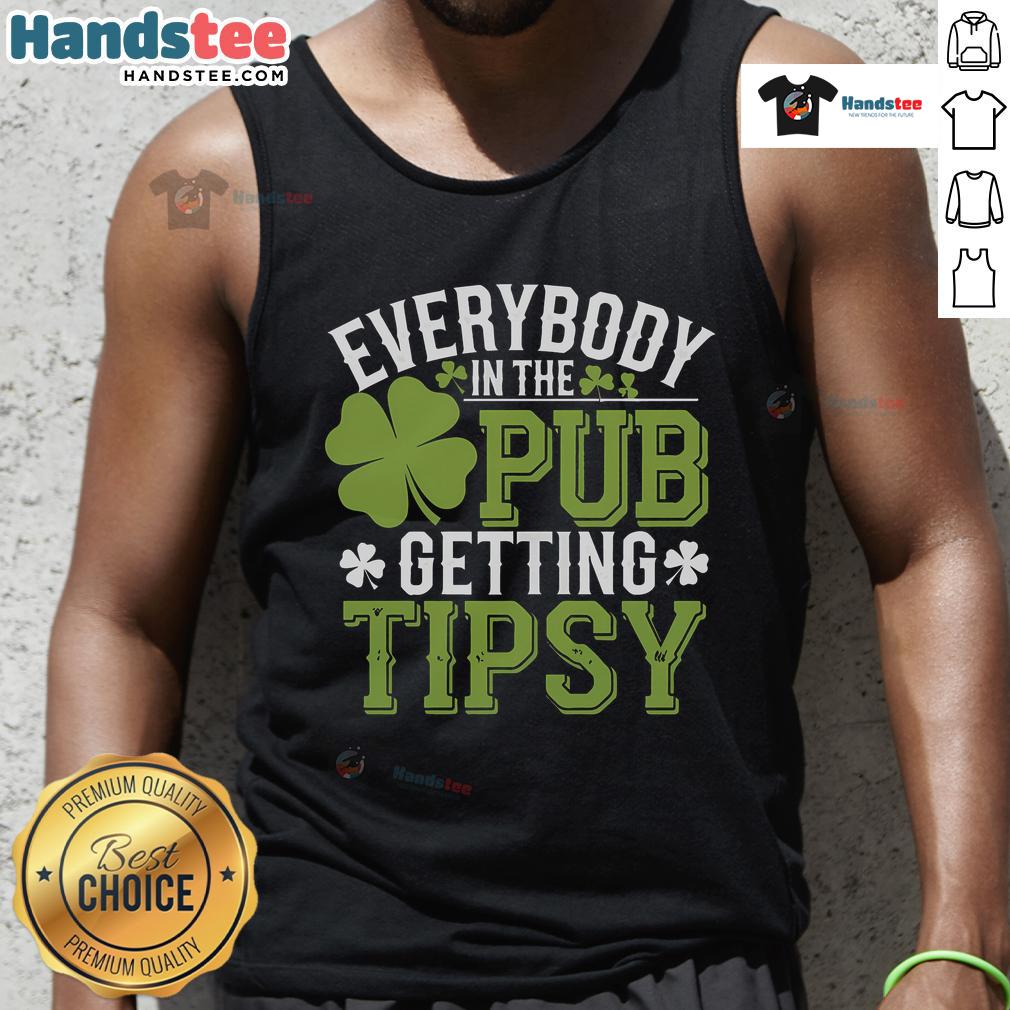 People enjoying drinks in a pub wearing St. Patrick's Day tank tops, celebrating and getting tipsy together.