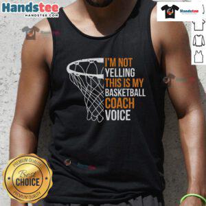 Basketball coach in a tank top saying This is my basketball coach voice, smiling and encouraging players on the court.