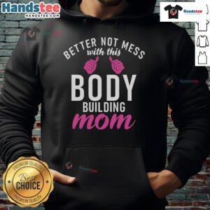 Bodybuilding mom wearing a 'Nice Better Not Mess With This Body' hoodie, showcasing strength and confidence.