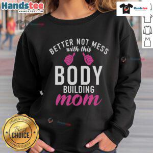 Bodybuilding mom wearing a 'Nice Better Not Mess With This Body' sweatshirt, showcasing strength and confidence.