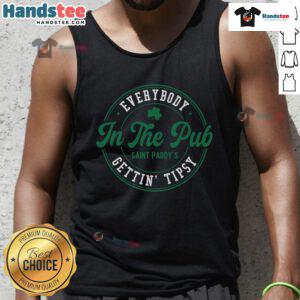 Group of friends wearing Saint Paddy tank tops, enjoying drinks and getting tipsy at a lively pub celebration.