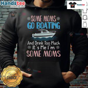 Happy mom wearing a 'Nice Moms Boating' hoodie, confidently steering a pontoon boat on a sunny day.