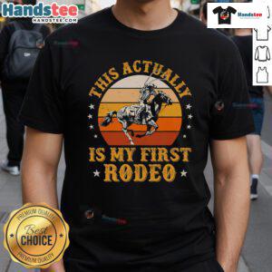 Vintage retro sunset cowboy t-shirt design with 'My First Rodeo' text, perfect for rodeo enthusiasts and casual wear.
