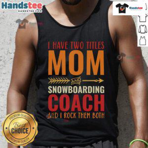 Woman wearing a tank top with 'Mom And Snowboarding Coach' graphic, showcasing her dual roles and passion for snowboarding.