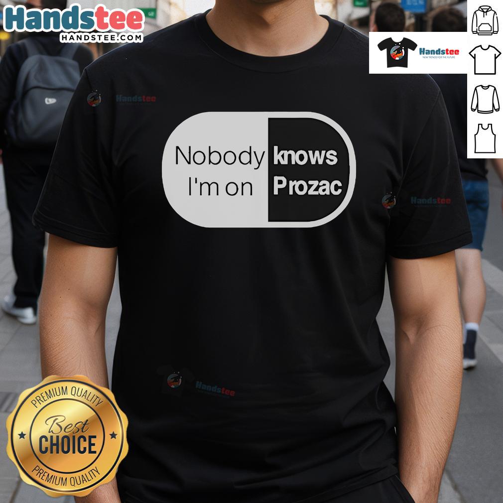 Robbie Williams 'Nobody Knows I'm On Prozac' T-Shirt featuring a vibrant design celebrating mental health awareness.