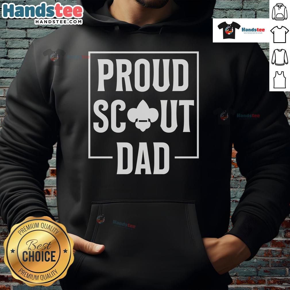 Scouting dad in a cozy hoodie enjoying camping in the wilderness with scouts, showcasing a love for outdoor adventure.
