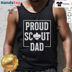Scouting dad in a tank top enjoying camping in the wilderness, showcasing his love for outdoor adventures and scouting.