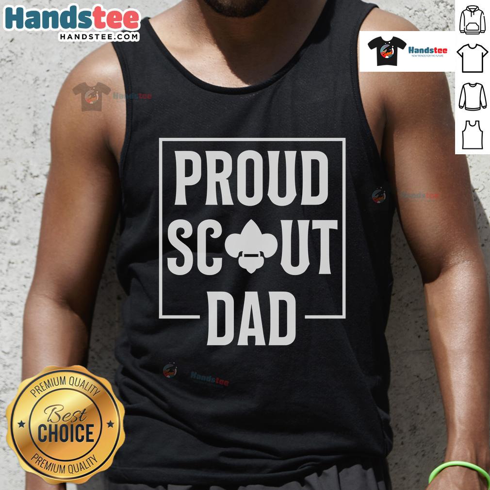 Scouting dad in a tank top enjoying camping in the wilderness, showcasing his love for outdoor adventures and scouting.