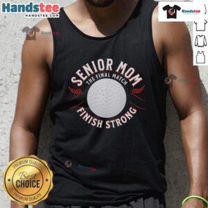 Nice senior mom wearing 'Finish Strong' tank top at the final match, celebrating her team's achievement and spirit.