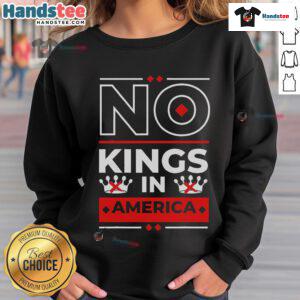 Alt Text: Official No Kings In America sweatshirt featuring We The People slogan for political apparel enthusiasts.