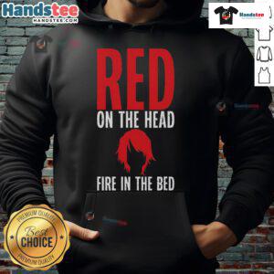 Alt Text: Funny redhead wearing a hoodie with 'Fire in the Bed' design, showcasing a playful style and vibrant colors.