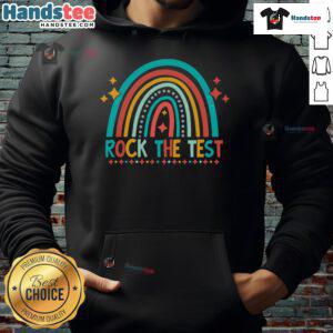 Student wearing a 'Good Rock The Test' rainbow hoodie smiles during testing day, showcasing positivity and confidence.