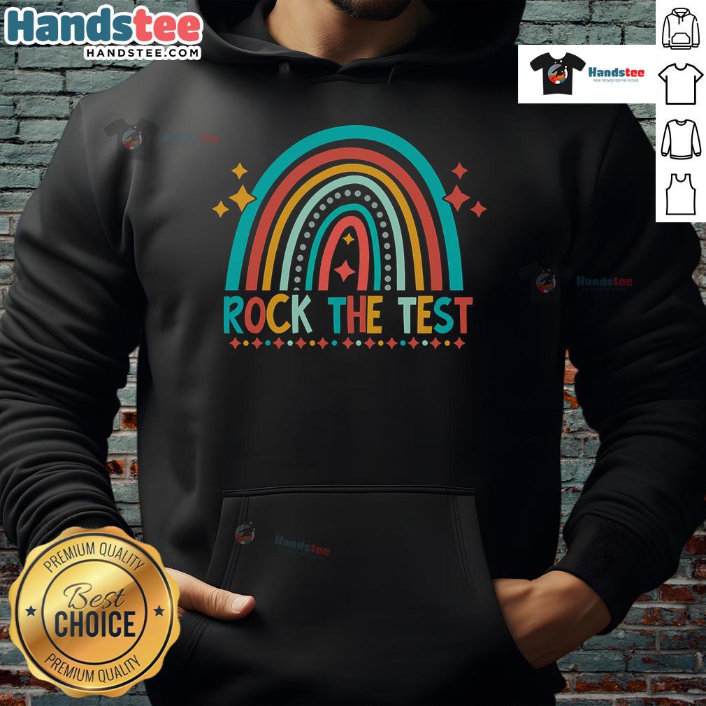 Student wearing a 'Good Rock The Test' rainbow hoodie smiles during testing day, showcasing positivity and confidence.