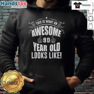 Happy 90-year-old wearing a festive hoodie celebrating their 90th birthday with joy and laughter.