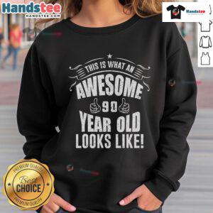 Alt Text: Joyful 90-year-old wearing a vibrant sweatshirt celebrating their 90th birthday with a big smile.