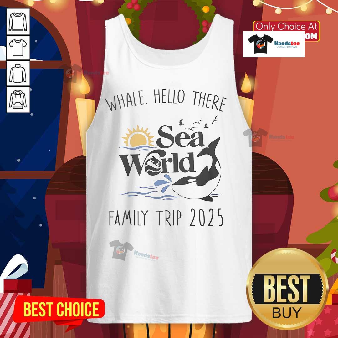Family wearing 'Good Whale, Hello There' tank tops at Sea World during their 2025 trip, enjoying marine life together.
