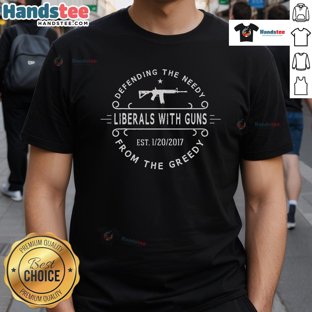 Hot Defending The Nerdy Liberals With Guns From The Greedy T-Shirt showcasing a bold graphic design for liberal activism.