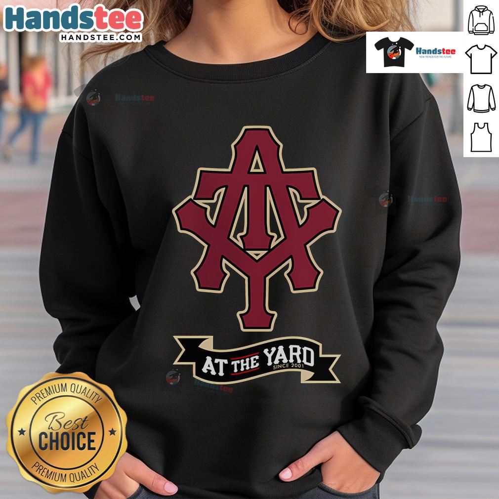 Cozy Nice At The Yard sweatshirt featuring stylish initials and a banner design, perfect for casual wear.