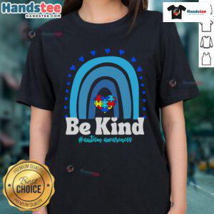 Colorful rainbow puzzle heart on a ladies tee promoting kindness and autism awareness. Nice Be Kind design.