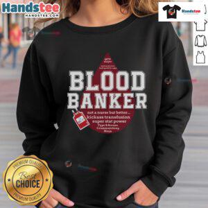 Lab scientist in a Nice Blood Bank sweatshirt at a medical lab during Lab Week, showcasing dedication to science.