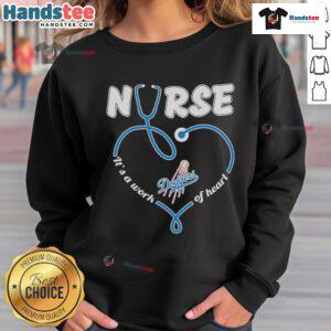 Cozy Nice Los Angeles Dodgers nurse sweatshirt, featuring 'It's a Work of Heart' slogan, perfect for fans and healthcare workers.