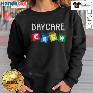 Alt Text: Official Daycare Crew sweatshirt worn by a childcare provider, showcasing a cozy and professional look for caregivers.