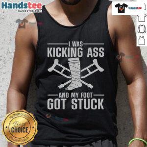 Funny tank top with 'I Was Kicking Ass' slogan, featuring a broken leg graphic, perfect for humor and recovery fashion.