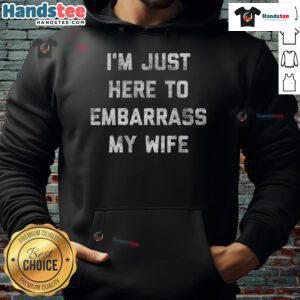 Funny workout hoodie saying 'I'm just here to embarrass my wife/husband/dad' perfect for gym humor and gifts.