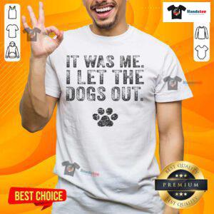 Funny 'It Was Me I Let The Dogs Out' distressed t-shirt for dog lovers, featuring playful text and a casual design.