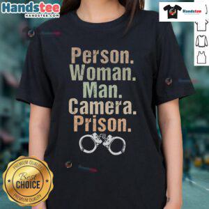 Funny woman and man posing with a camera in prison-themed ladies tee, showcasing humor and style.