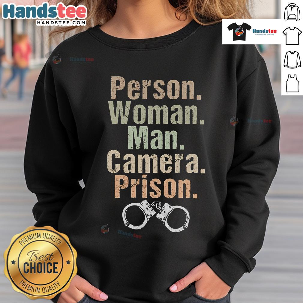 Funny person wearing a prison sweatshirt poses for the camera with a man, showcasing a playful and humorous vibe.