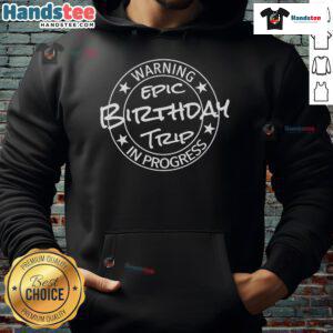 Group wearing matching hoodies with 'Epic Birthday Trip 2024 in Progress' funny warning design, celebrating together.