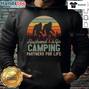 Happy couple wearing 'Good Bigfoot Camping Husband and Wife Partners for Life' hoodie, enjoying nature together.