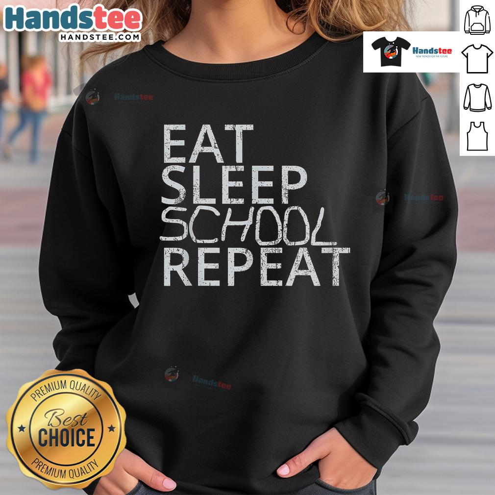Vintage sweatshirt featuring 'Good Eat Sleep School Repeat' design, perfect for back-to-school style.