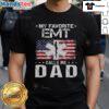 Alt Text: Proud dad wearing 'Good My Favorite EMT Calls Me Dad' Fathers Day T-shirt, celebrating fatherhood and EMT pride.