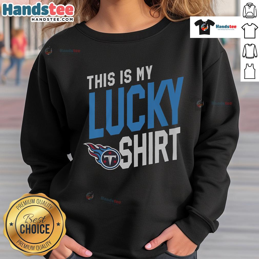 Alt Text: Fan wearing a lucky sweatshirt featuring the Tennessee Titans logo at a game, showcasing team spirit and pride.