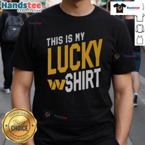 Alt Text: Happy fan wearing a 'This Is My Lucky T-Shirt' supporting the Washington Commanders at a game.