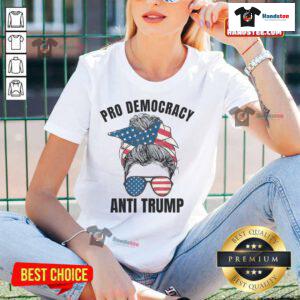 Hot Pro Democracy Anti-Trump ladies tee with messy bun design and American flag graphic, perfect for patriotic activism.