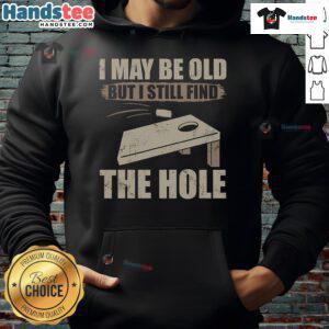 Nice I May Be Old But I Still Find The Hole Cornhole Hoodie displayed on a model, showcasing its fun design and cozy fit.