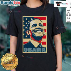 Alt Text: Happy Barack Obama, 44th President, wearing a ladies tee with American flag, representing Democrat pride.