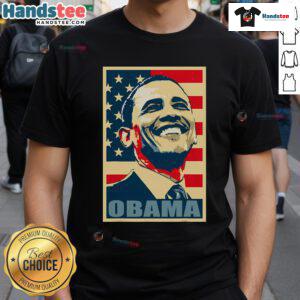 Happy Barack Obama wearing a 44th President t-shirt with an American flag, showcasing his Democrat pride.