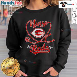 Nice nurse in a Cincinnati Reds sweatshirt, showcasing team spirit and comfort during a casual day out.